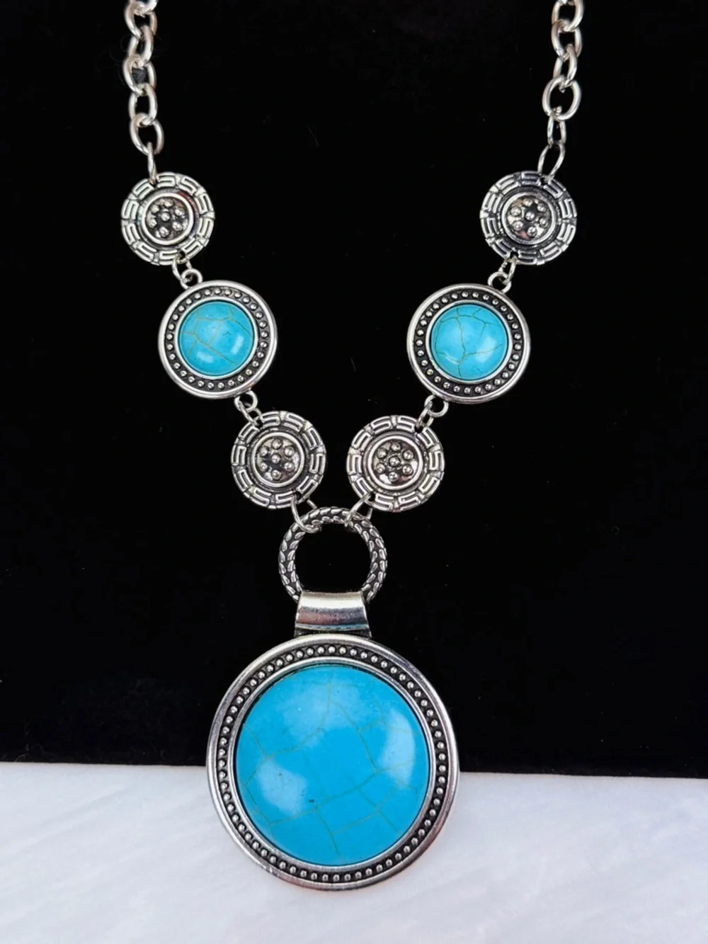 Silvertone, weighted southwestern style blue faux turquoise necklace